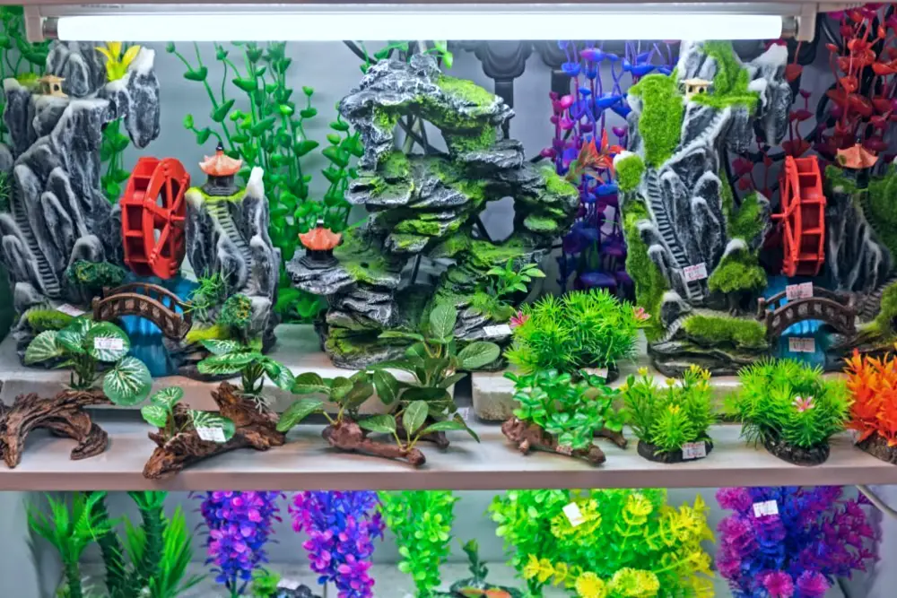 Artificial Aquarium Decorations — A shelf packed with various colorful and vibrant aquarium decorations 